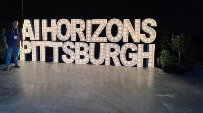 PulseSpark AI team attending the AI Horizons Summit in Pittsburgh, discussing AI advancements and solutions for businesses.